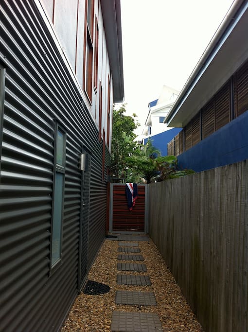 Entry is divided from the back yard providing security for pets.