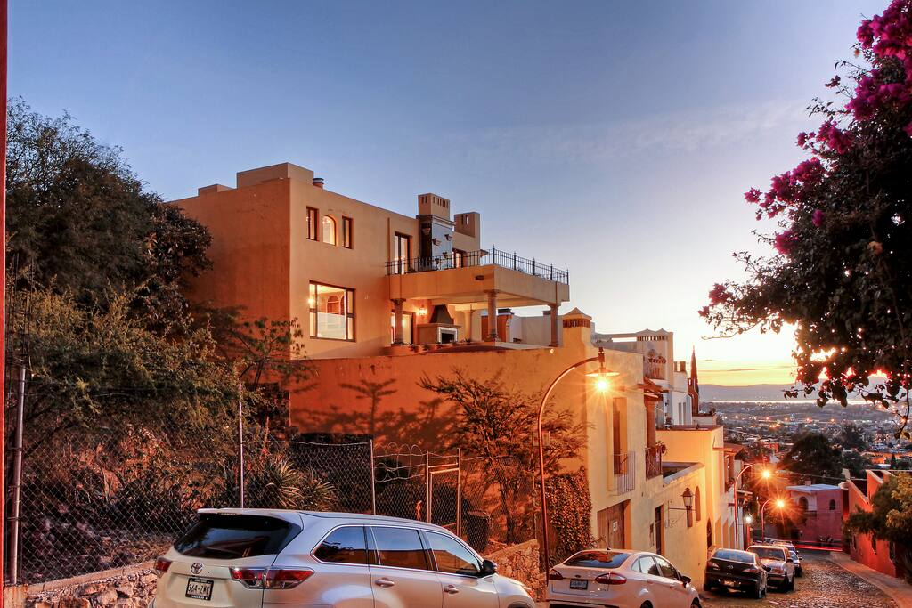 A full view of the house as seen from the cobblestone street below in the exclusive Balcones neighbourhood.