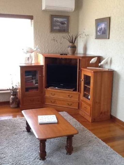 Flat screen TV, DVDs and phone dock.