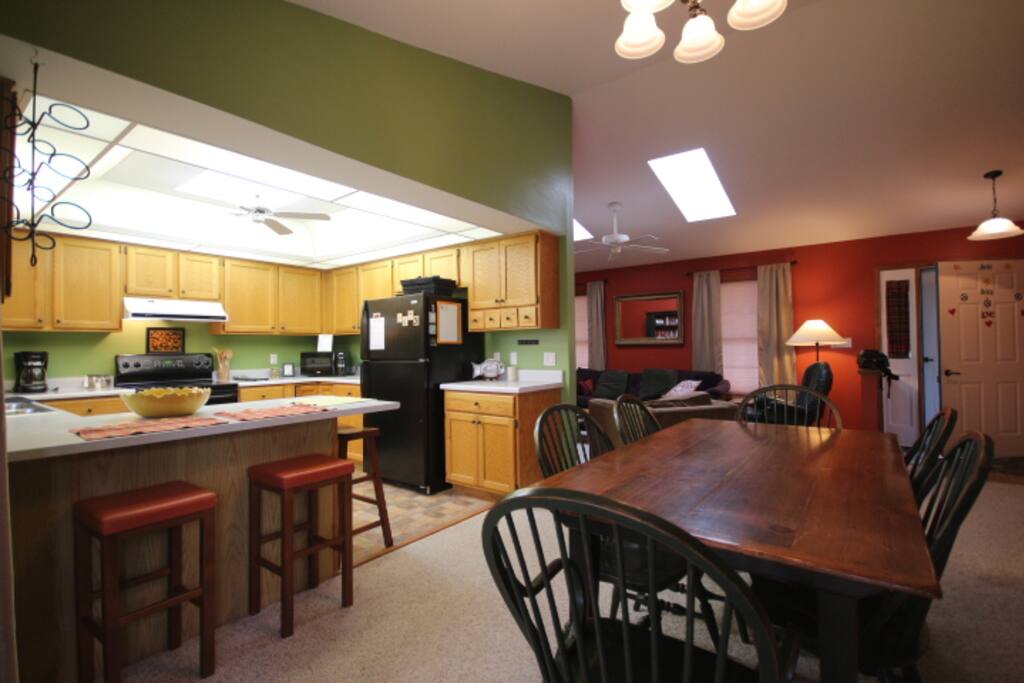 Dining room looking into kitchen/living area