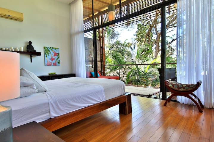 View from your master bedroom which opens to the lovely balcony overlooking the tropical gardens. Wake up in paradise.