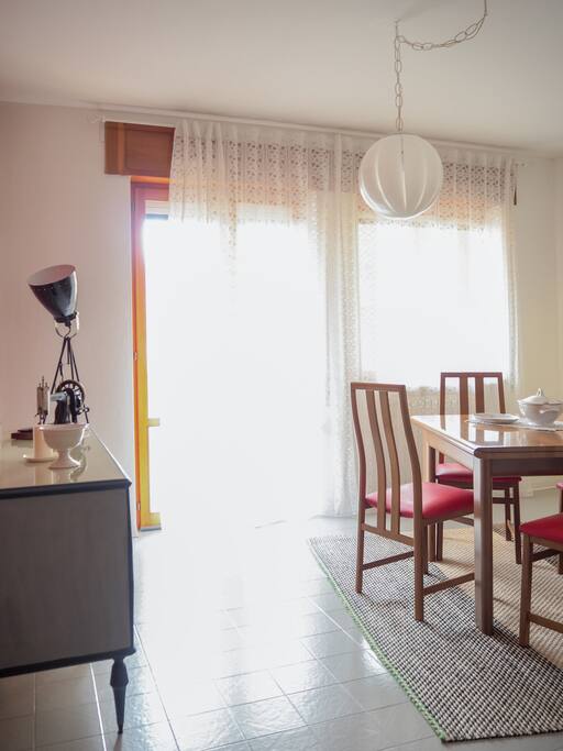 Lounge for dining and relaxing with the exit door to the private terrace.