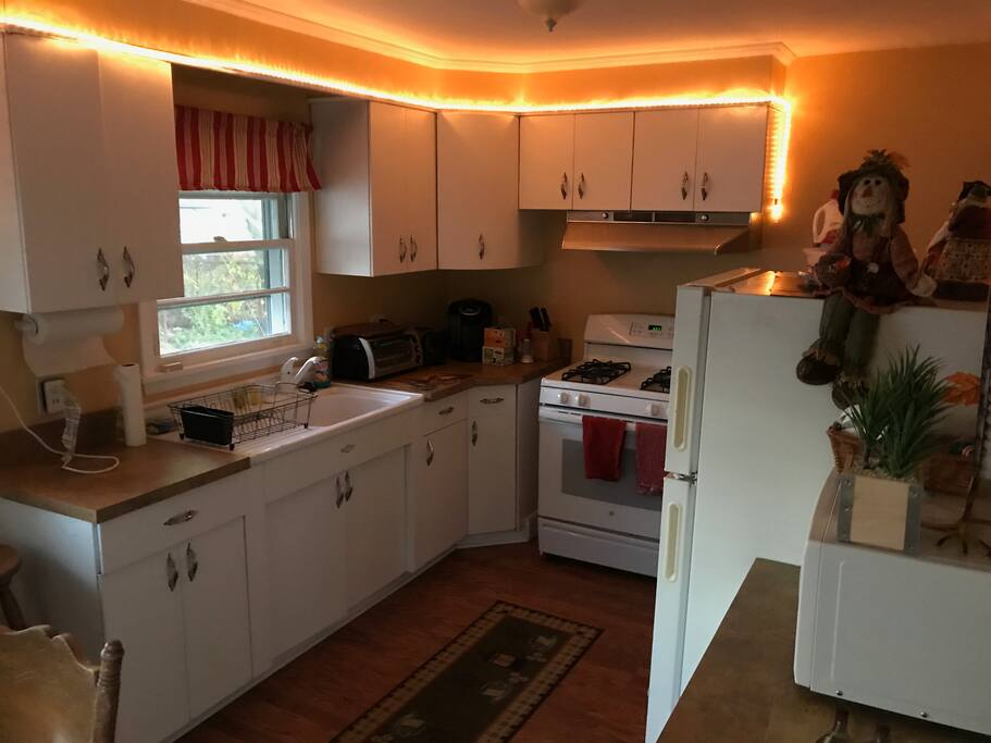 Kitchen, new gas stove, refridgerator, ceiling fan, keurig coffee maker, microwave, toaster oven