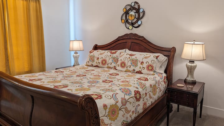 King sized bed, chest of drawers, smart tv, private deck and master bathroom.