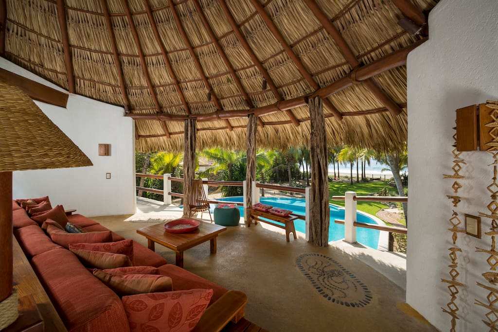 Great Room with view of pool, beach, and tropical grounds