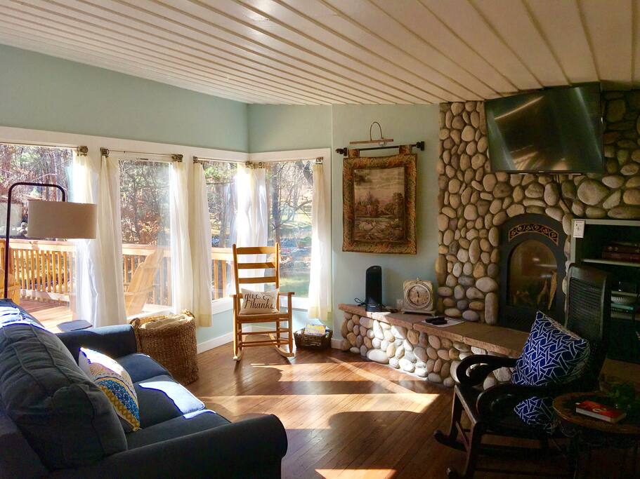Bright and open den with an abundance of natural light, 40 inch Sony Bravia over the remote controlled gas fireplace.