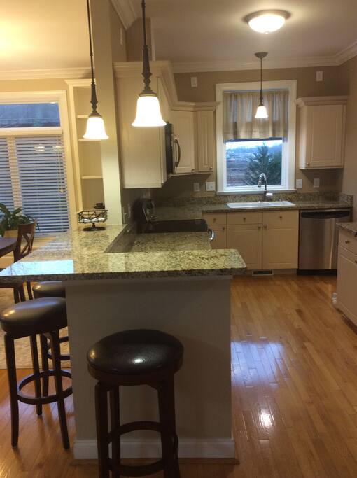 Breakfast bar with granite counter and SS appliances