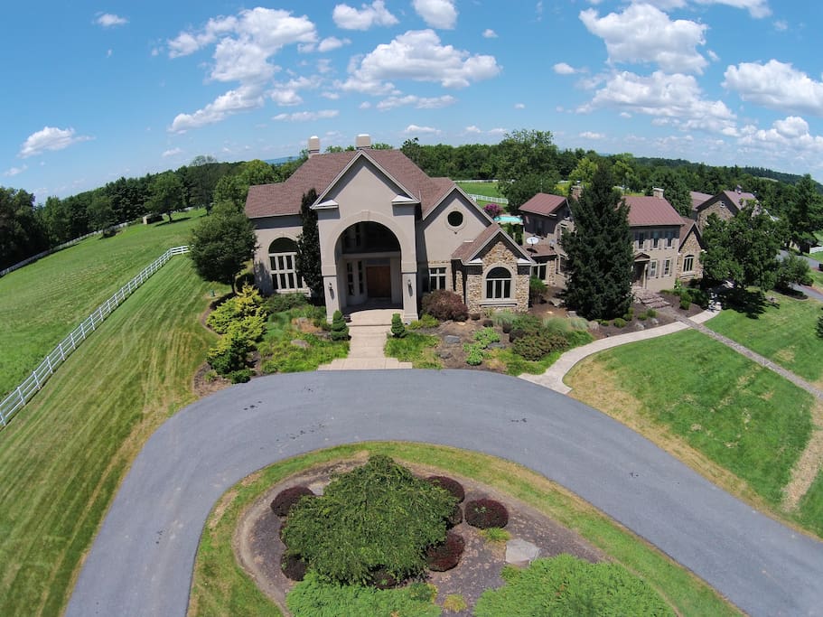 An aerial shot of the front of the house, in which your guest room is located!