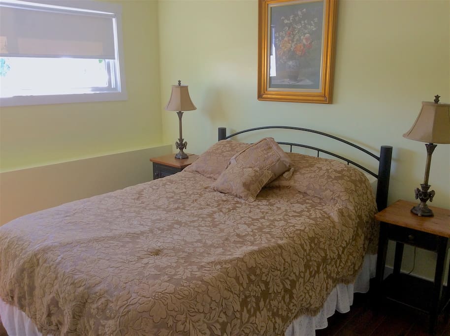 Bedroom D with a queen size bed located in the basement