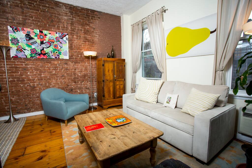 The living room has lots of cozy, new furniture. The queen sofa bed has a deluxe mattress—no bars!