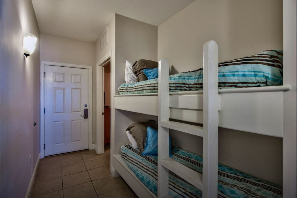 Bunk beds built into the wall in the hallway.