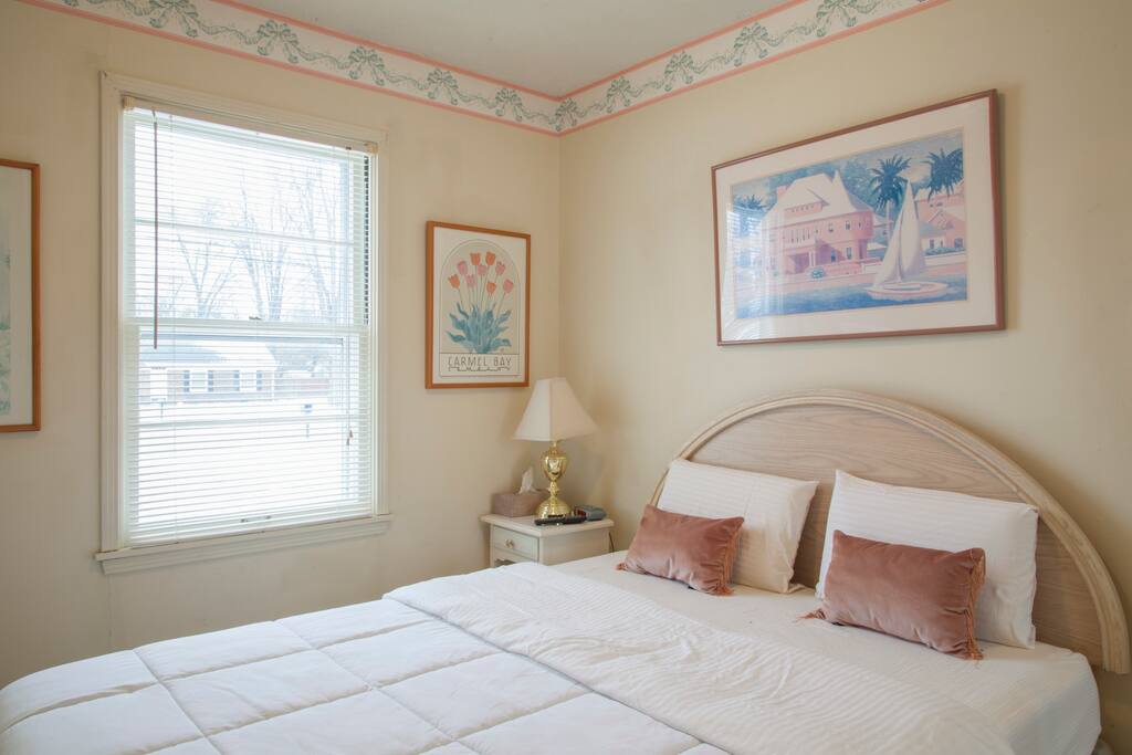 Queen size bed in bedroom three.