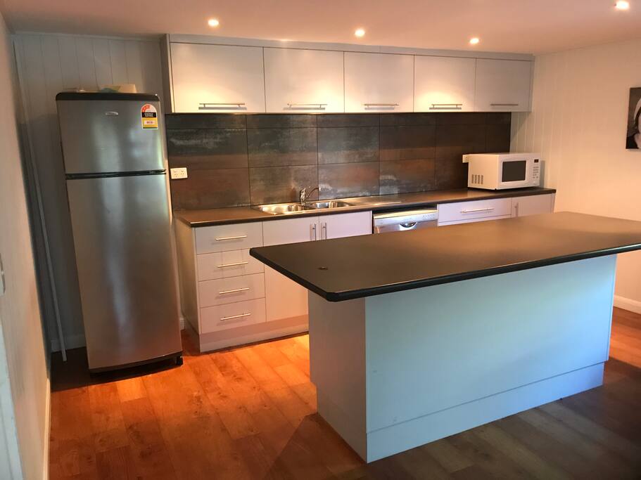 The kitchen has two electric hot plates, one hot plate grill, slow cooker, microwave, toaster and kettle.
