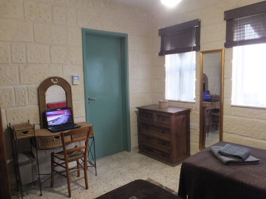 Laptop desk, Blinds, and blackout with privacy curtains.