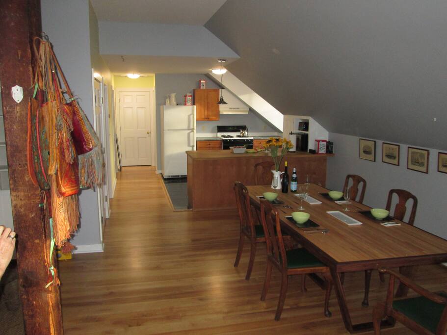 Looking through the apartment. Kitchen dormer window faces the river. Bedrooms are down the hall to the left. Bathroom is at the end of the hall on the right.