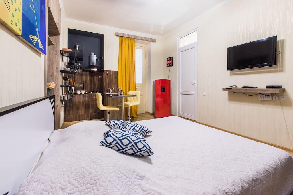 Comfortable double bed and a large flat screen TV that shows numerous local and international channels.