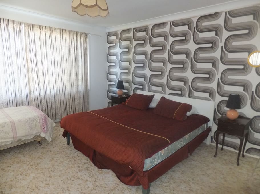 double bedroom with king bed and a single