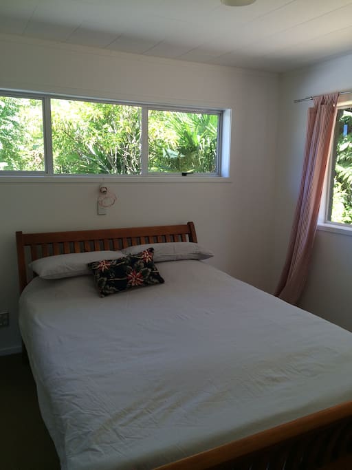 Bedroom with Queen bed overlooking garden