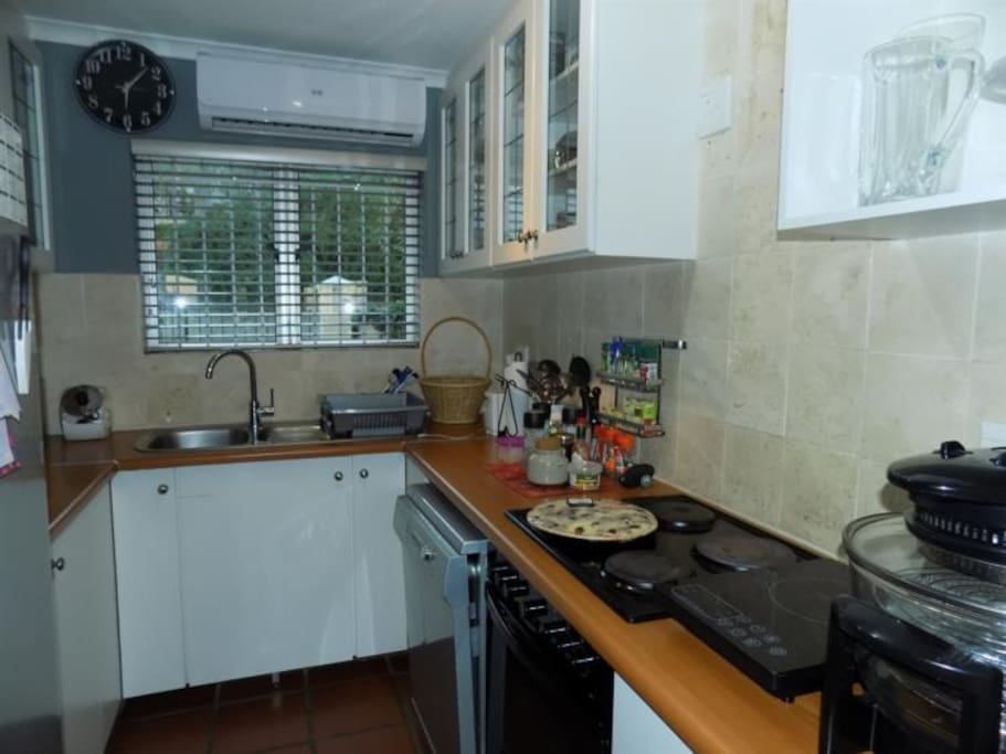 Fully equipped kitchen with dishwasher, microwave and stove