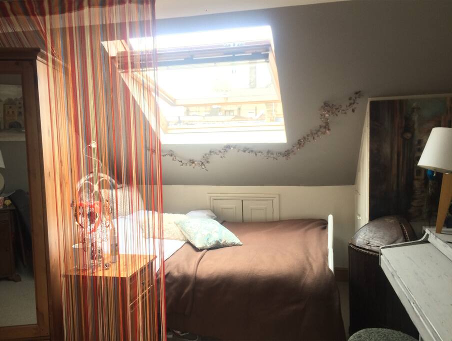 Super comfy bed with an attic window for a fresh breeze! (you can blackout for a total darkness too)