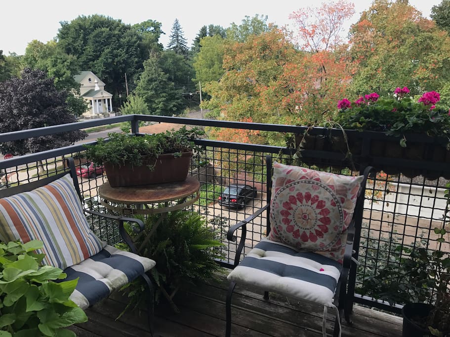 Two spacious outdoor terraces with beautiful views — complete with gas grill and comfortable lounge seating.
