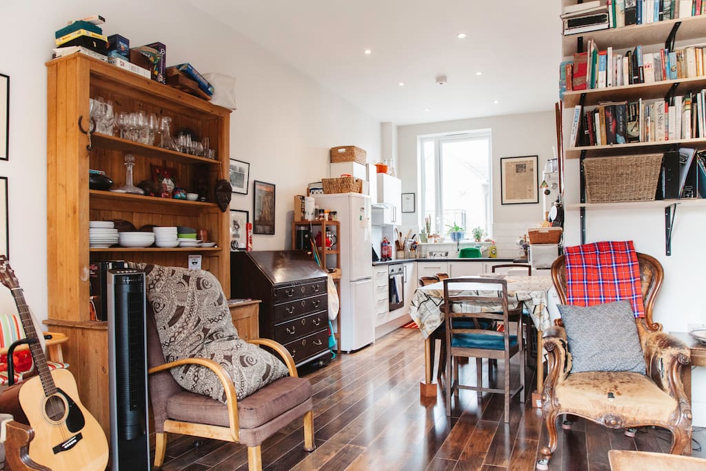 Living room + kitchen with full amenities including dishwasher, oven, stove, washer and dryer!