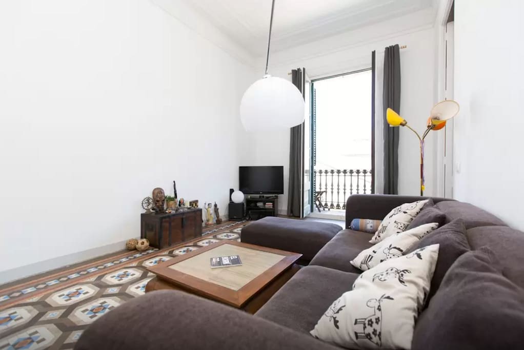 Spacious living room; full of natural light.