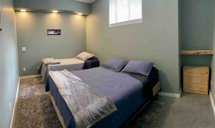3rd bedroom with queen bed and twin bed. This bedroom is located in the basement with access to full bathroom.