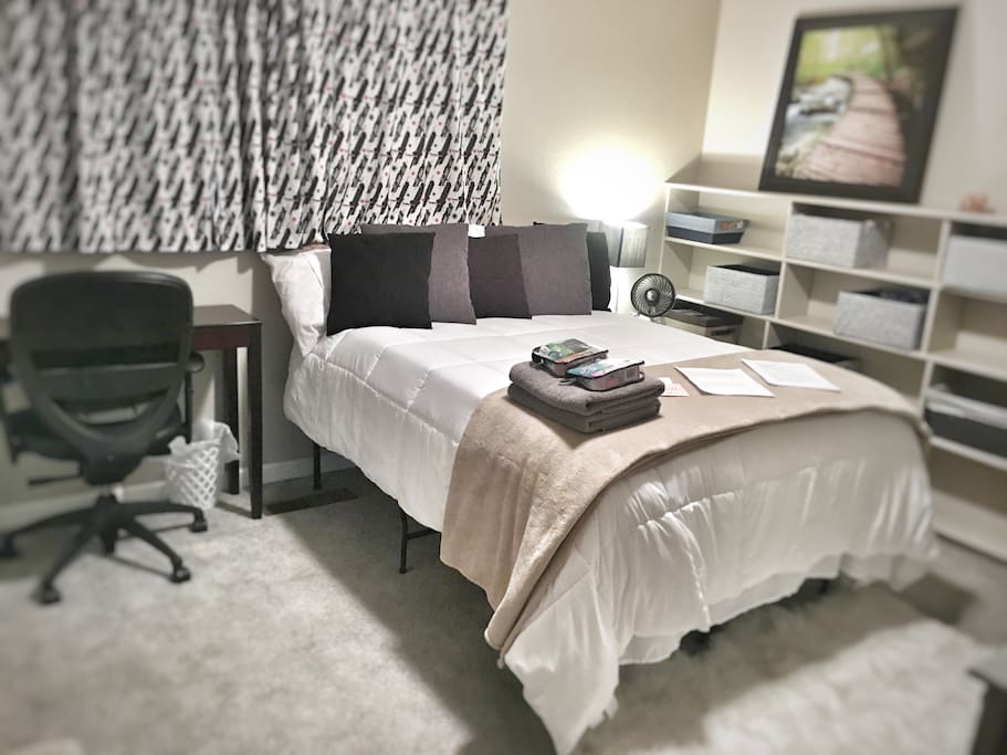 Full size bed with topper and down comforter. Blackout curtains to allow you to sleep in.