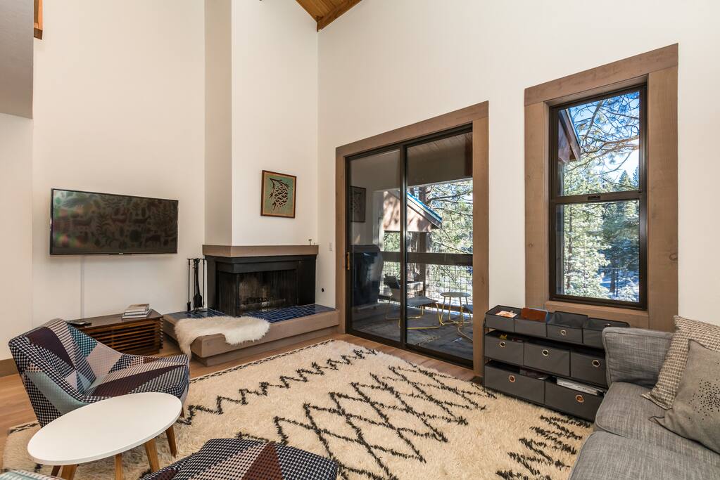 Great room offers a wood fireplace and flat screen tv with dvd/cable