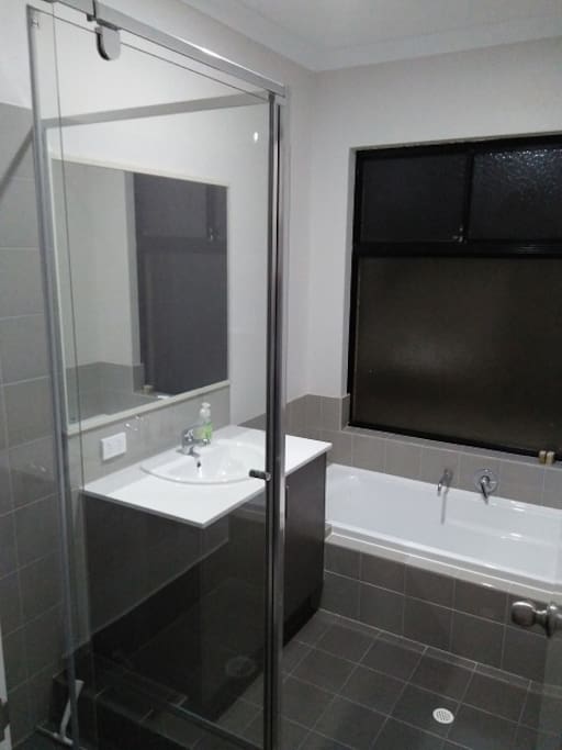 Near new bathroom with shower and bath