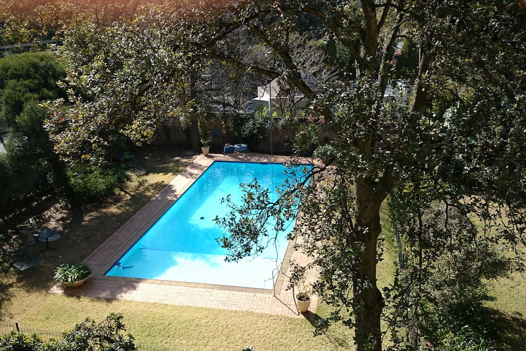 Our apartment complex's Pool with braai (BBQ) facilities on the left. Garden is on the right.