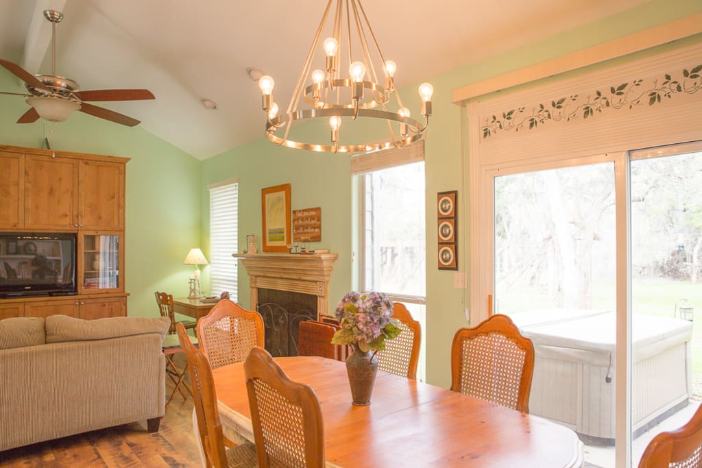 Enjoy your time in the open Living Room, Dining Area, & well equipped Kitchen.
If you are fortunate enough to see them, wildlife, including various birds, pass through the backyard, at all hours.
The dining table is a great place to play games!