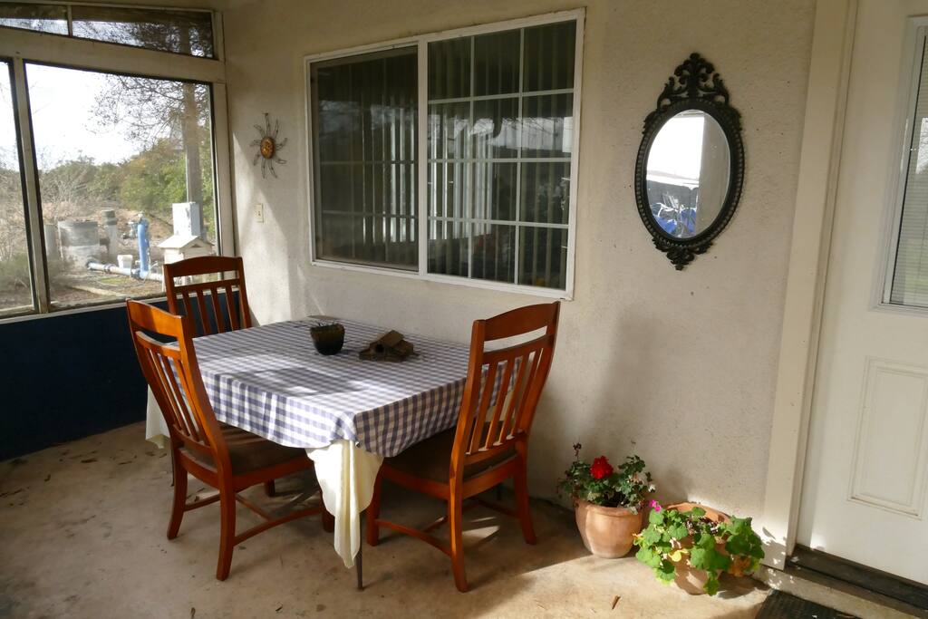 Screened-in front porch for morning coffee.