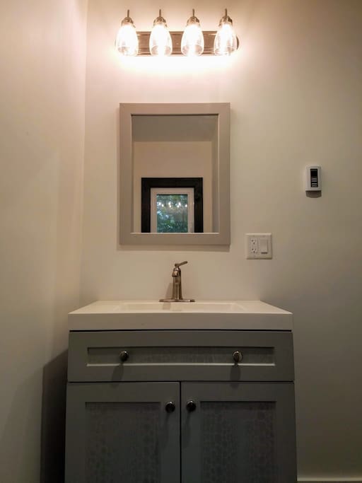 Stylish and functional bathroom includes heated floors!