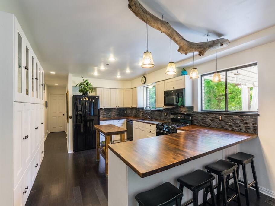Chef's kitchen, custom cabinets 5 burner stove.