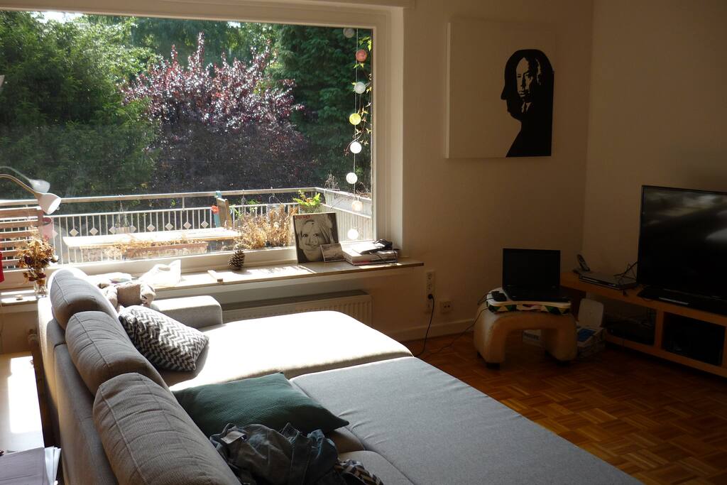 Living room with sofa (sofa bed) and huge window front