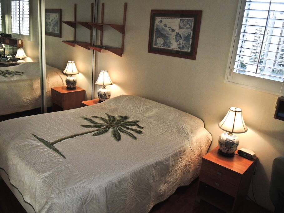 A separate bedroom includes a queen bed.