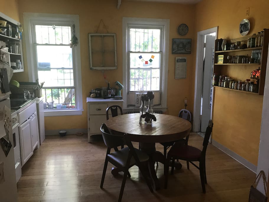 Large kitchen with a large table and many spices