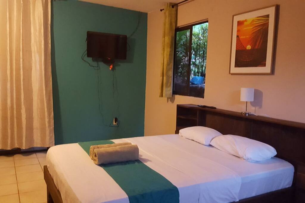 Another view of the bed with TV to watch and relax to after a long day!