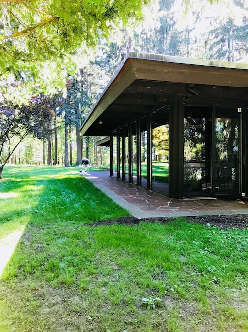 Living room features a wall of glass with panoramic views.