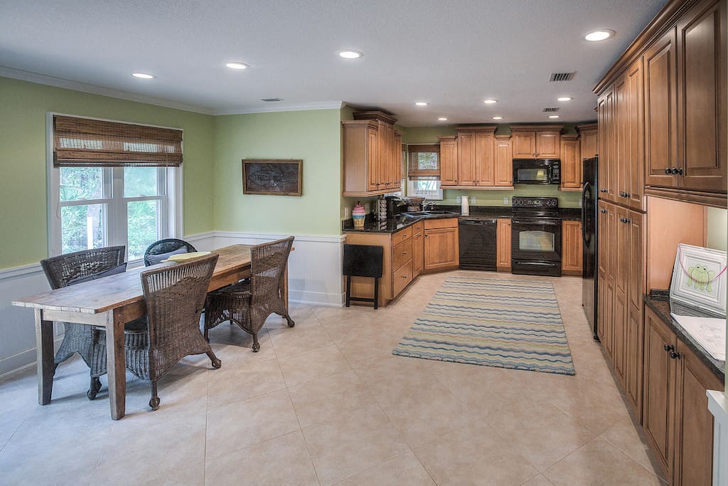 Open floor plan; view from family room into kitchen/dining