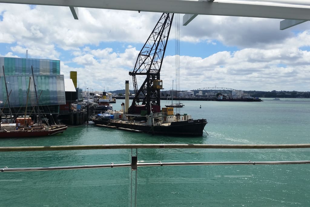 View form the apartment living room with the Viaduct harbour and the Auckland harbour bridge.