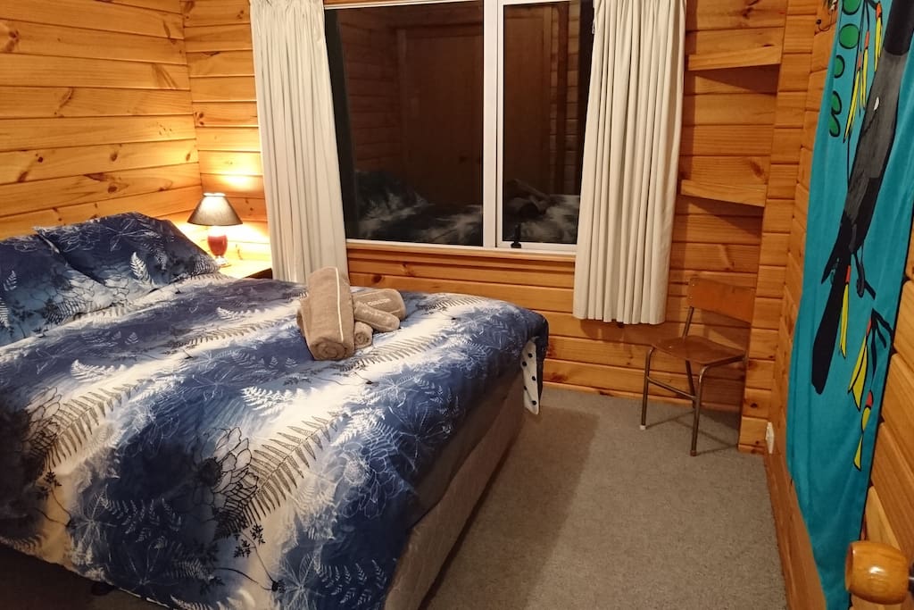 Double bed in room with wardrobe