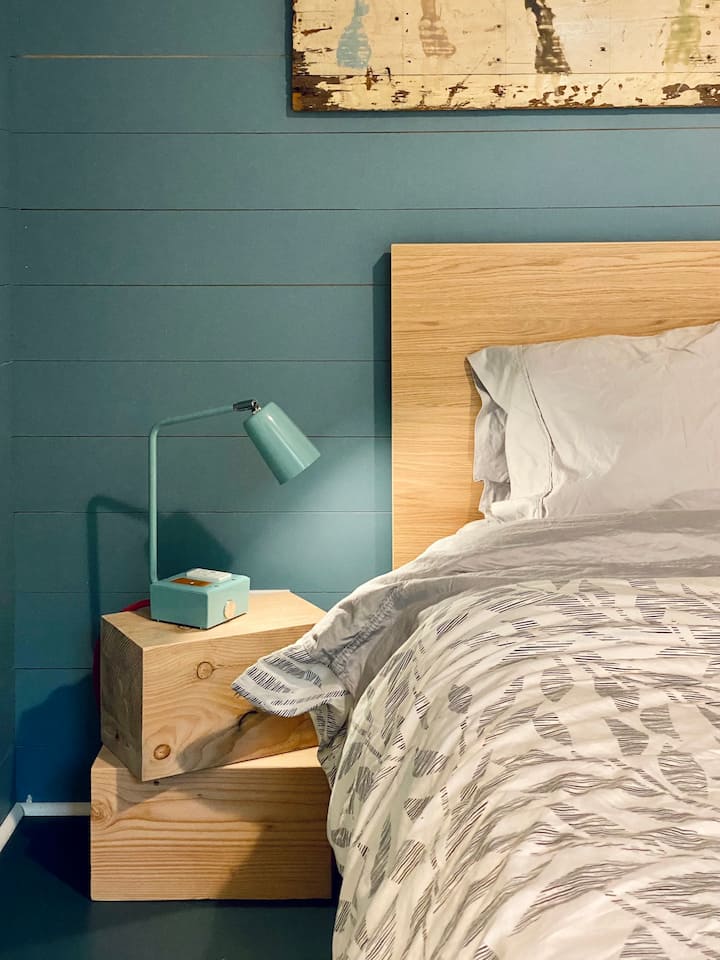 The blue room has a queen bed and views north over the lake.