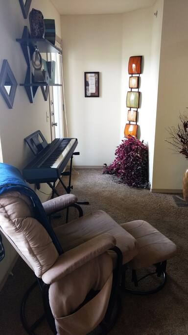 View of Living Room from the front door. The door to the balcony is on the left.