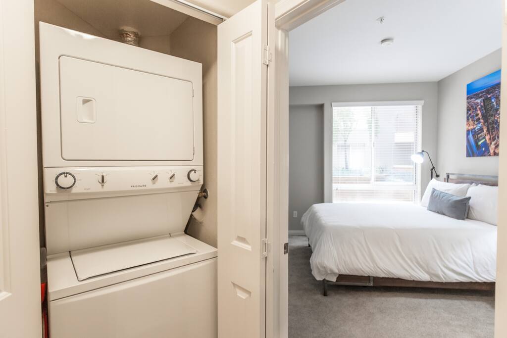 Your spacious bedroom with memory foam bed, luxurious bedding. Plus in-flat washer & dryer in corridor.