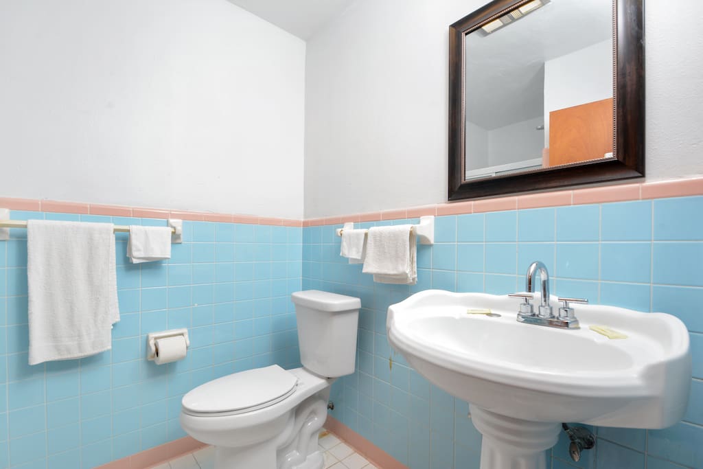 Clean roomy bathroom, energy efficient toilets