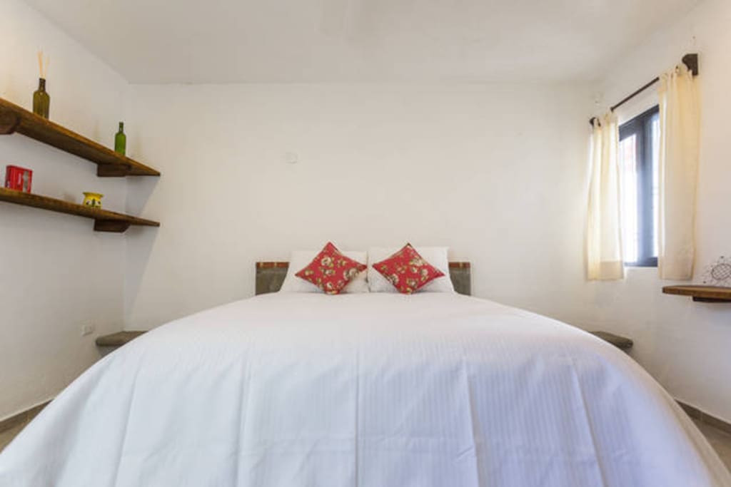 Bedroom with high quality queen size bed, air conditioner and spacious closet