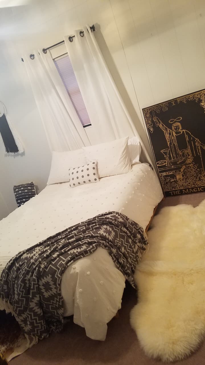 The Magician Room with lush 700+ thread count Pima cotton sheets, down comforter, down and memory foam pillows.